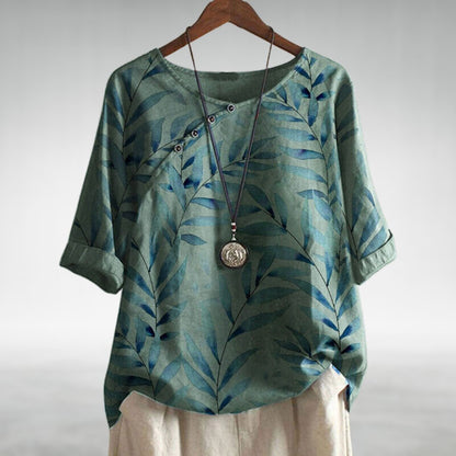 Simone | Chic blouse with playful asymmetric button and modern flair